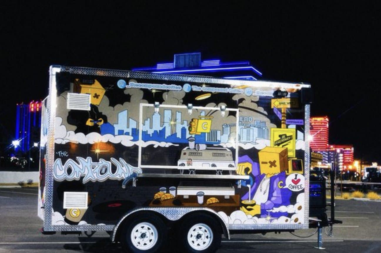 The Compound truck at night in front of downtown Reno casinos